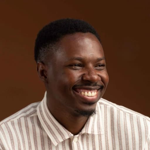 A portrait image of Femi smiling
