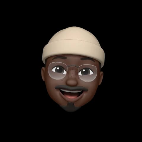 A memoji image of Femi smiling