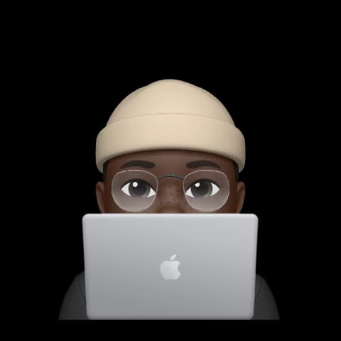 A memoji image of Femi at the back of a MacBook